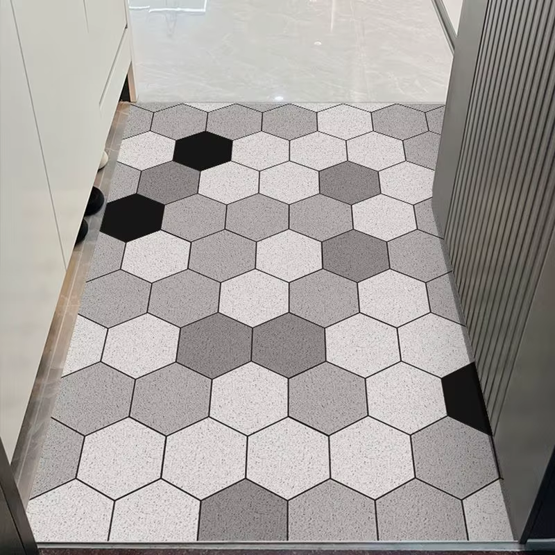 Le tapis de porte d'entrée peut être nettoyé avec un tapis de porte domestique en PVC. Le tapis d'en